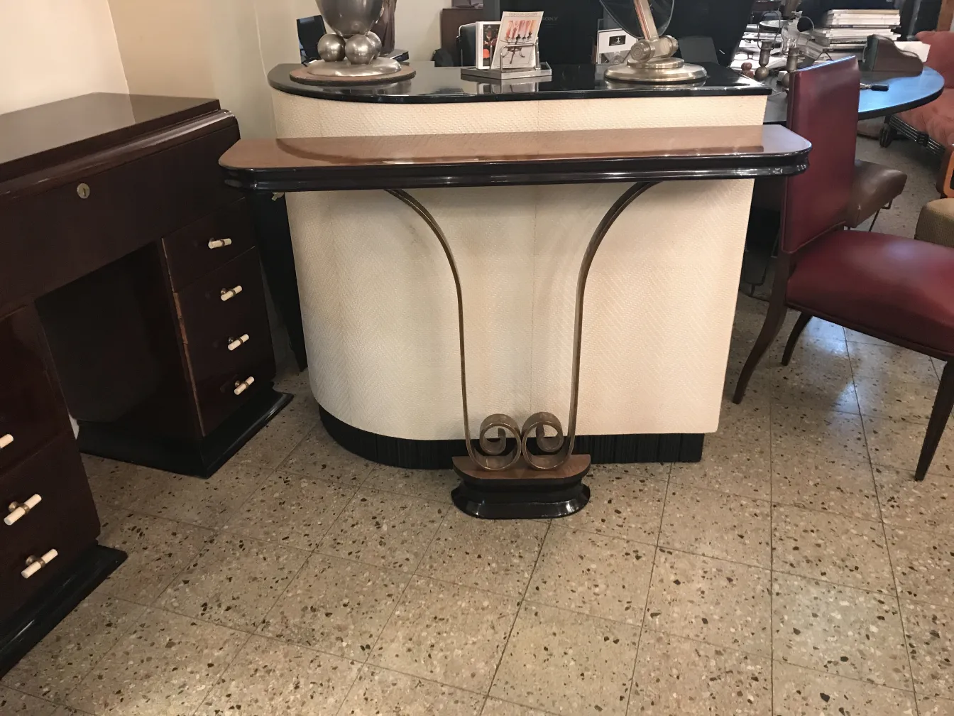 Two antique consoles with a curvy design and elegance, classic ambiance