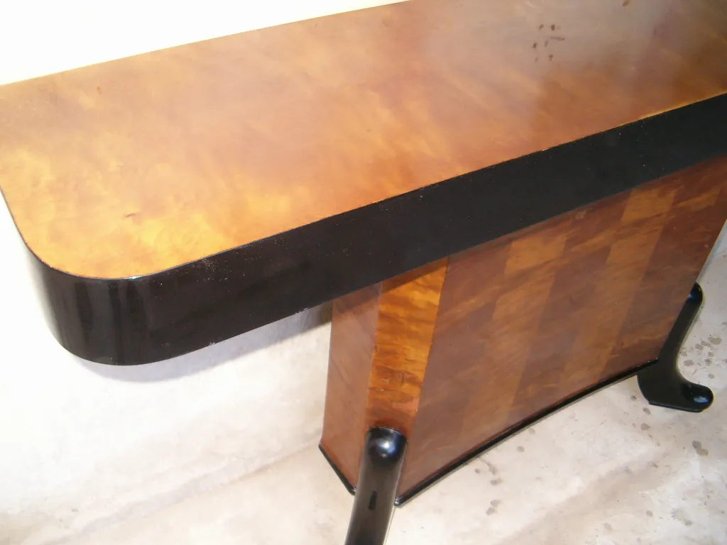 two vintage consoles with a glossy finish in a neutral setting