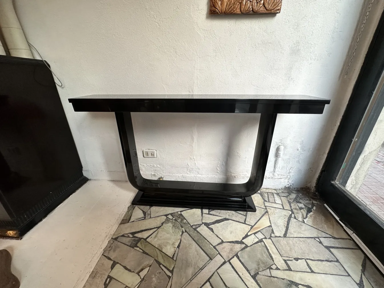 two antique consoles with a sleek design in a cozy setting