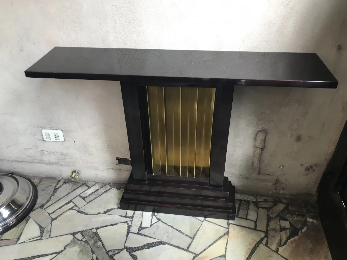 two antique consoles with gold accents