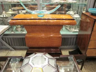 antique consoles displayed in a showcase environment
