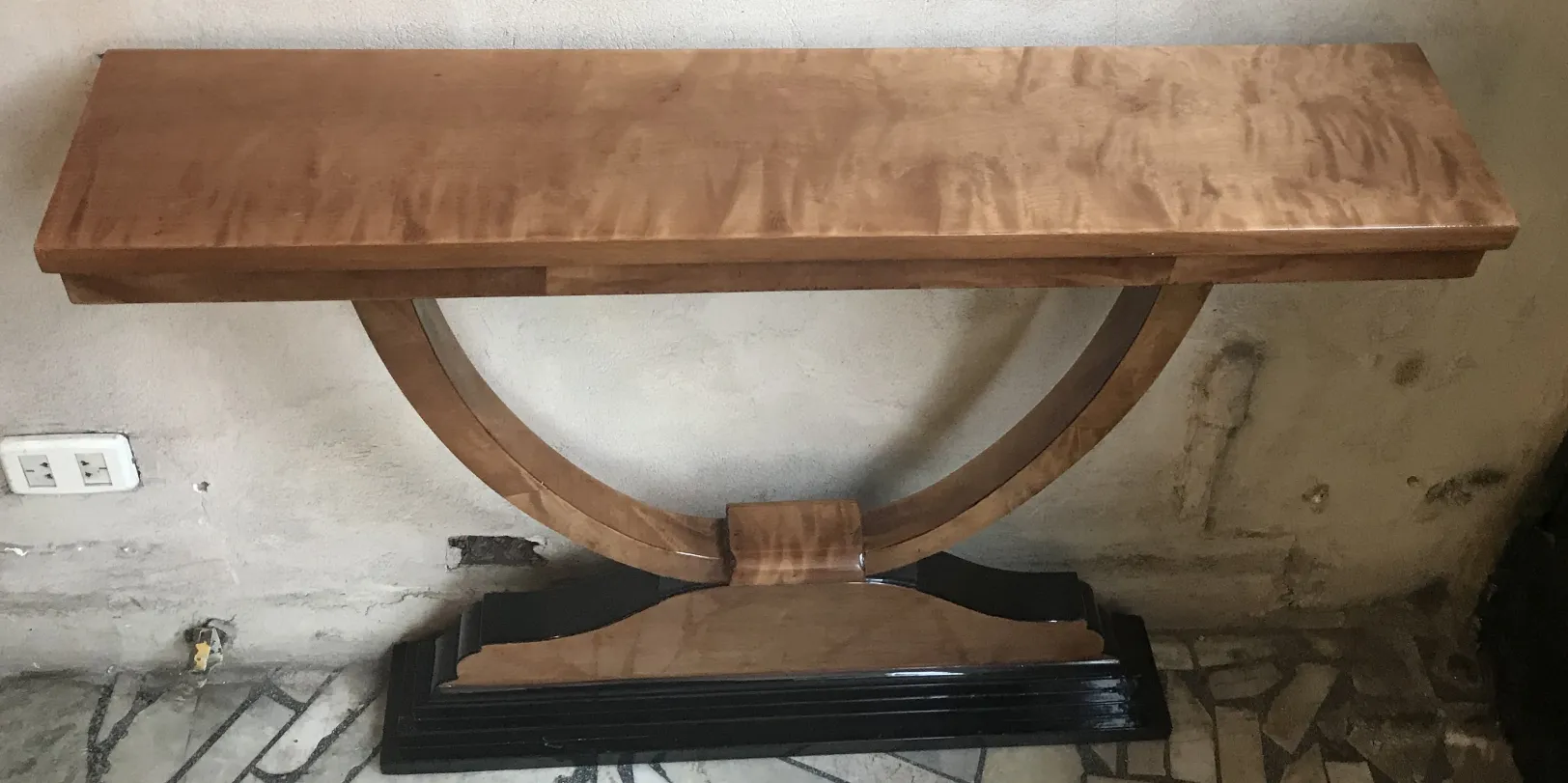 two antique consoles with curved design in rustic setting