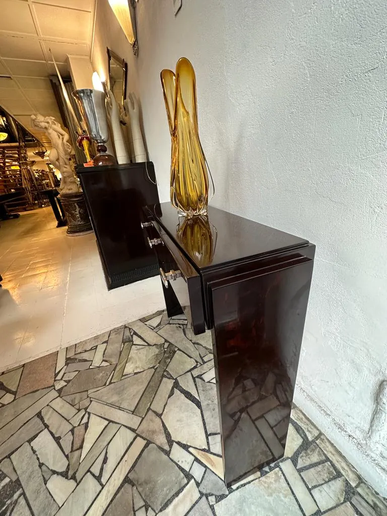 two antique consoles with decorative vase and surroundings