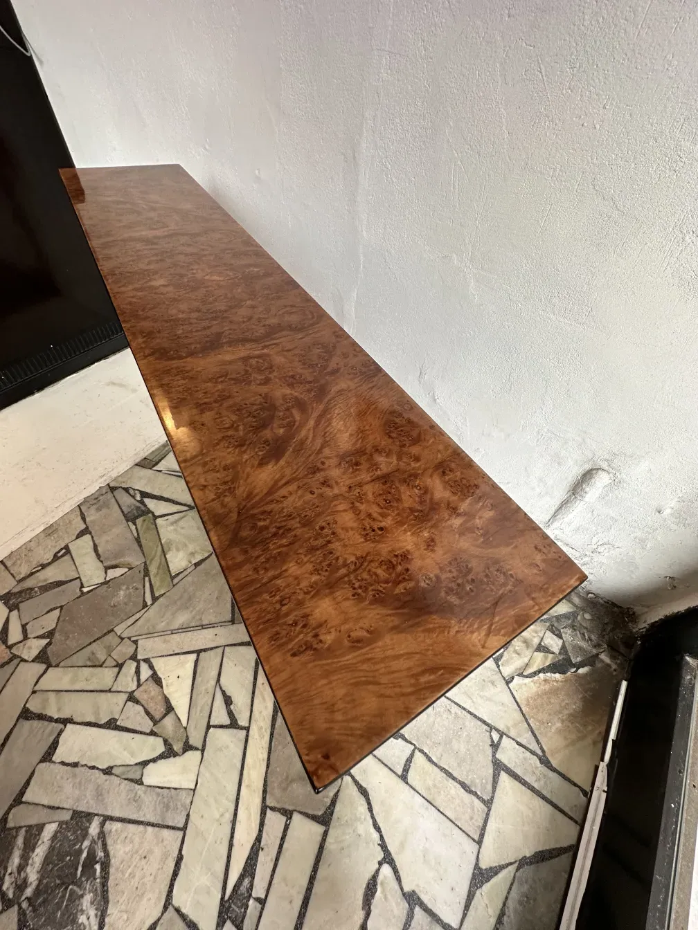 Three antique console tables in an elegant cozy setting
