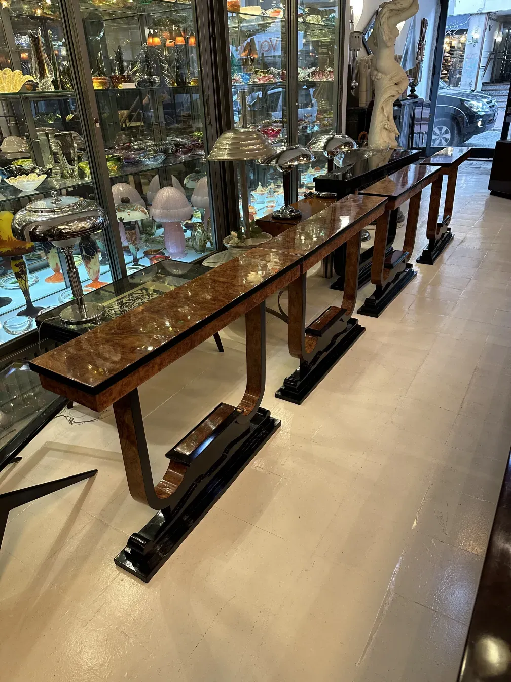 Three antique consoles in an elegant setting, decorated