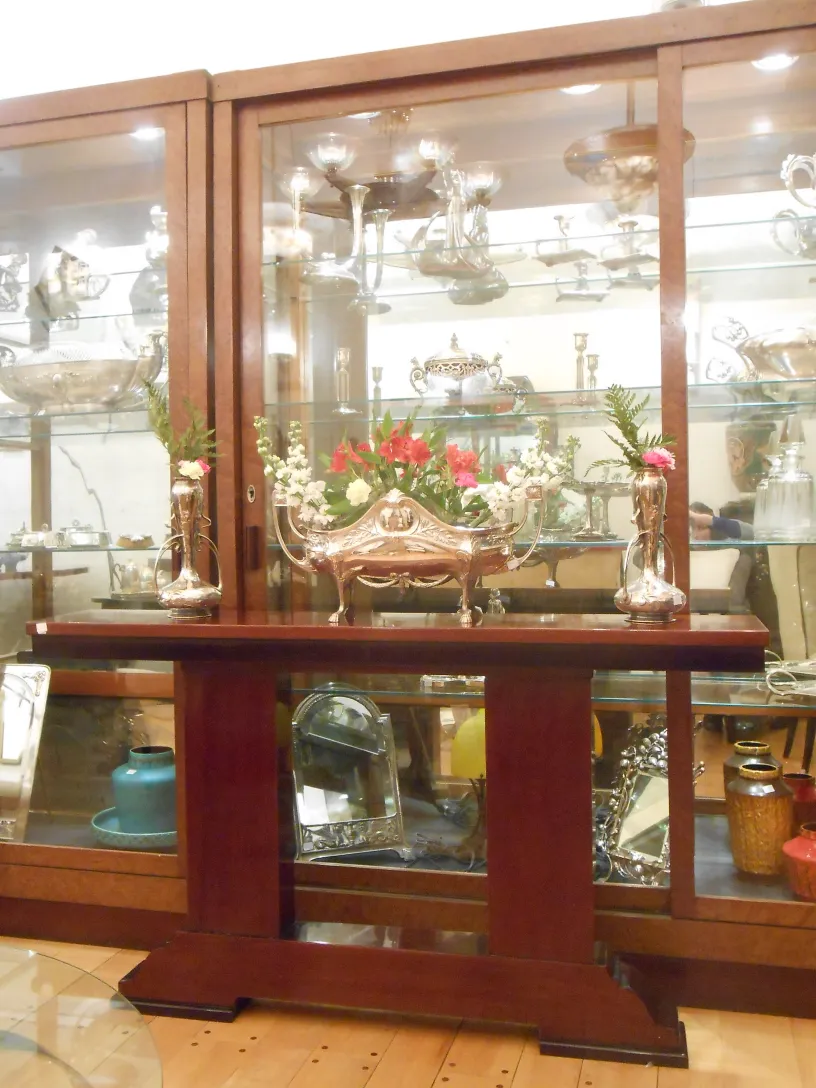 three antique consoles with floral decoration and metal