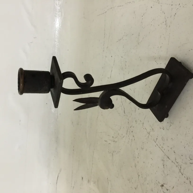 antique candelabra with decorative base and elegant curves