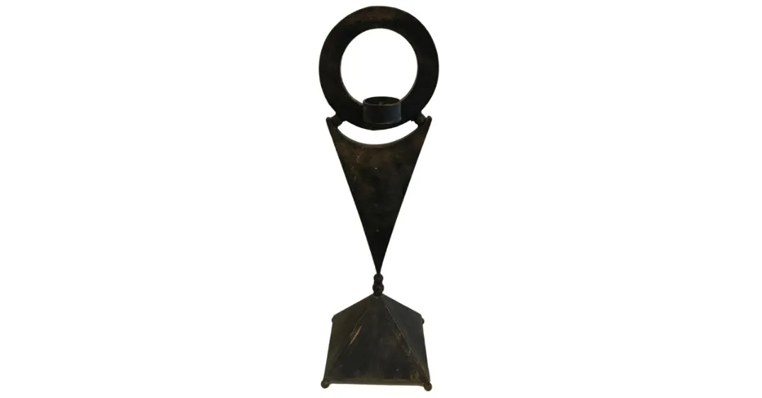 Elegant antique candelabra with a triangular base.