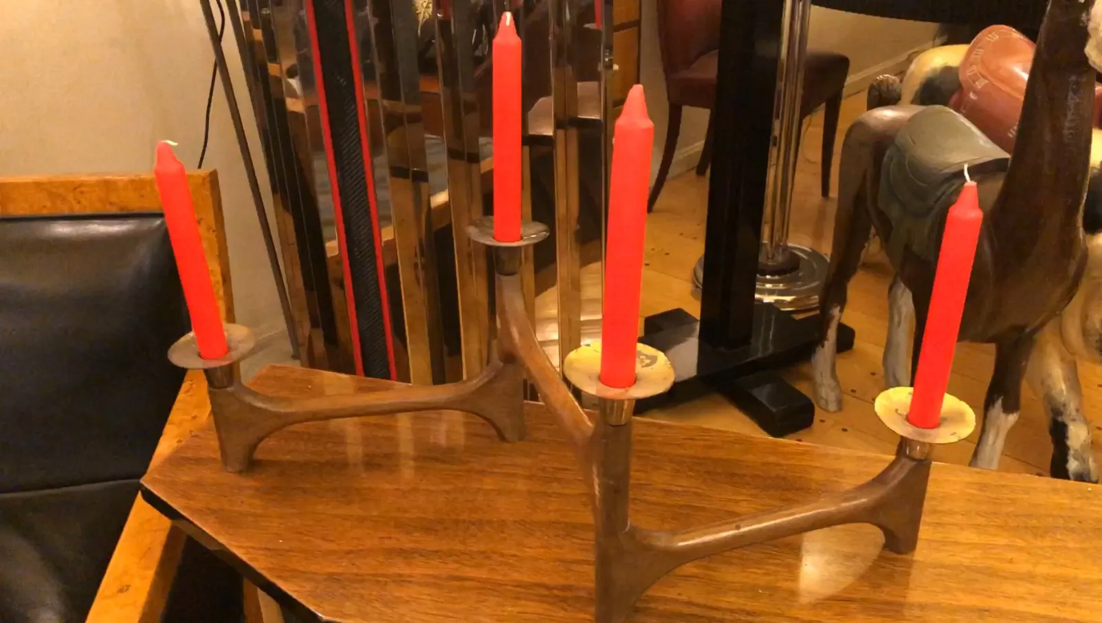 Antique candelabra with red candles on a table