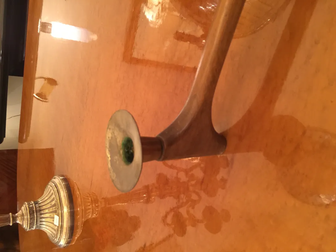 antique candelabra with decorative base on table