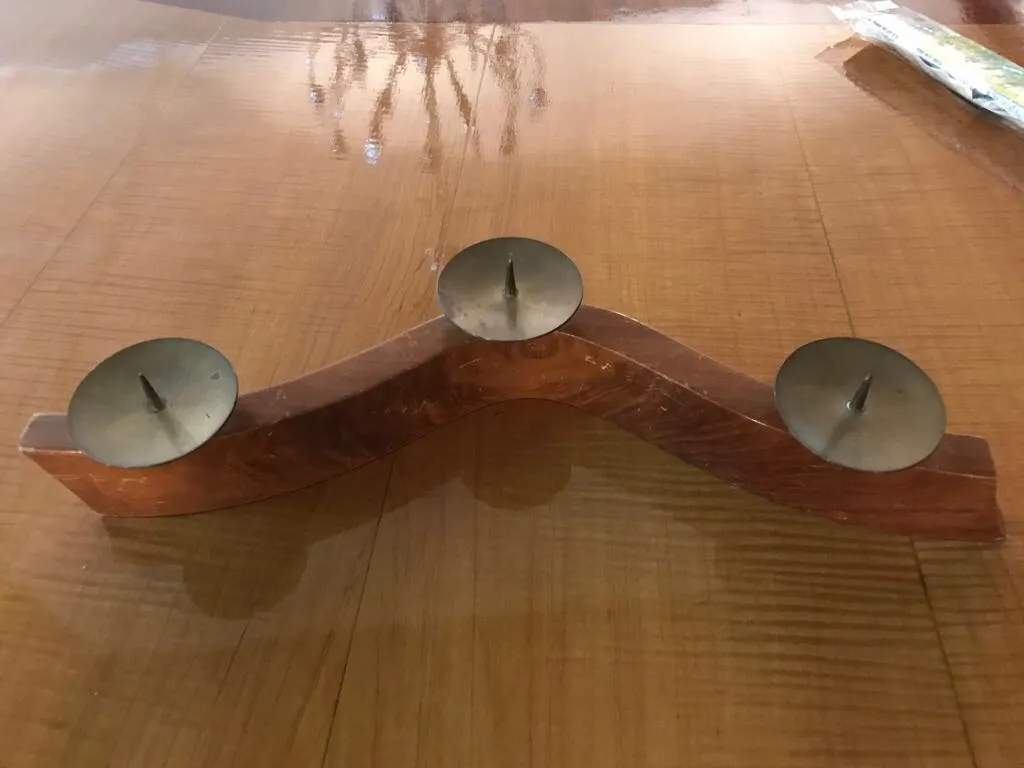 antique candelabra with wavy design and three lights