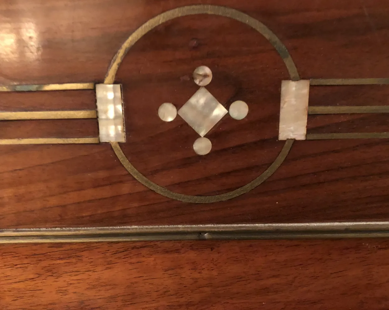 antique bed with decorative designs on the headboard