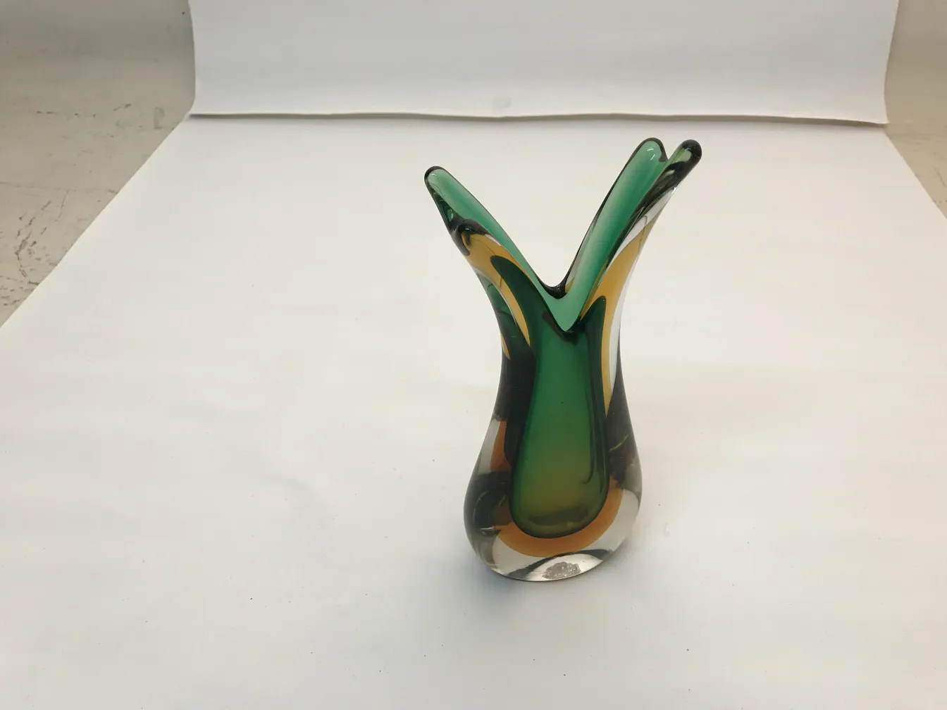 elegant murano vase with vibrant colors in a neutral setting