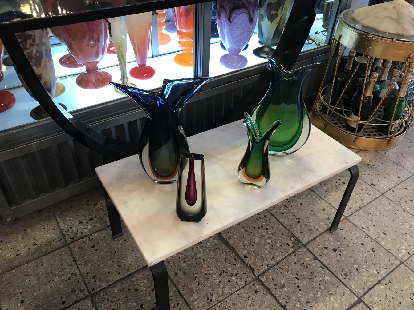 antique murano vase with stylized shape and vibrant colors in an antique setting