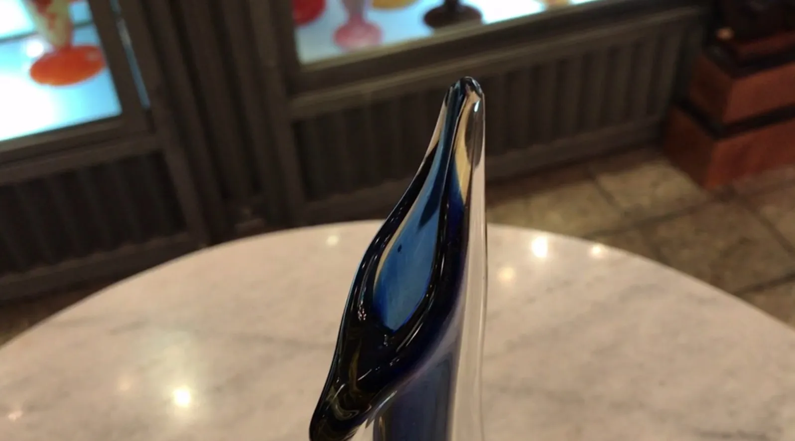 antique Murano vase with a shiny blue design.