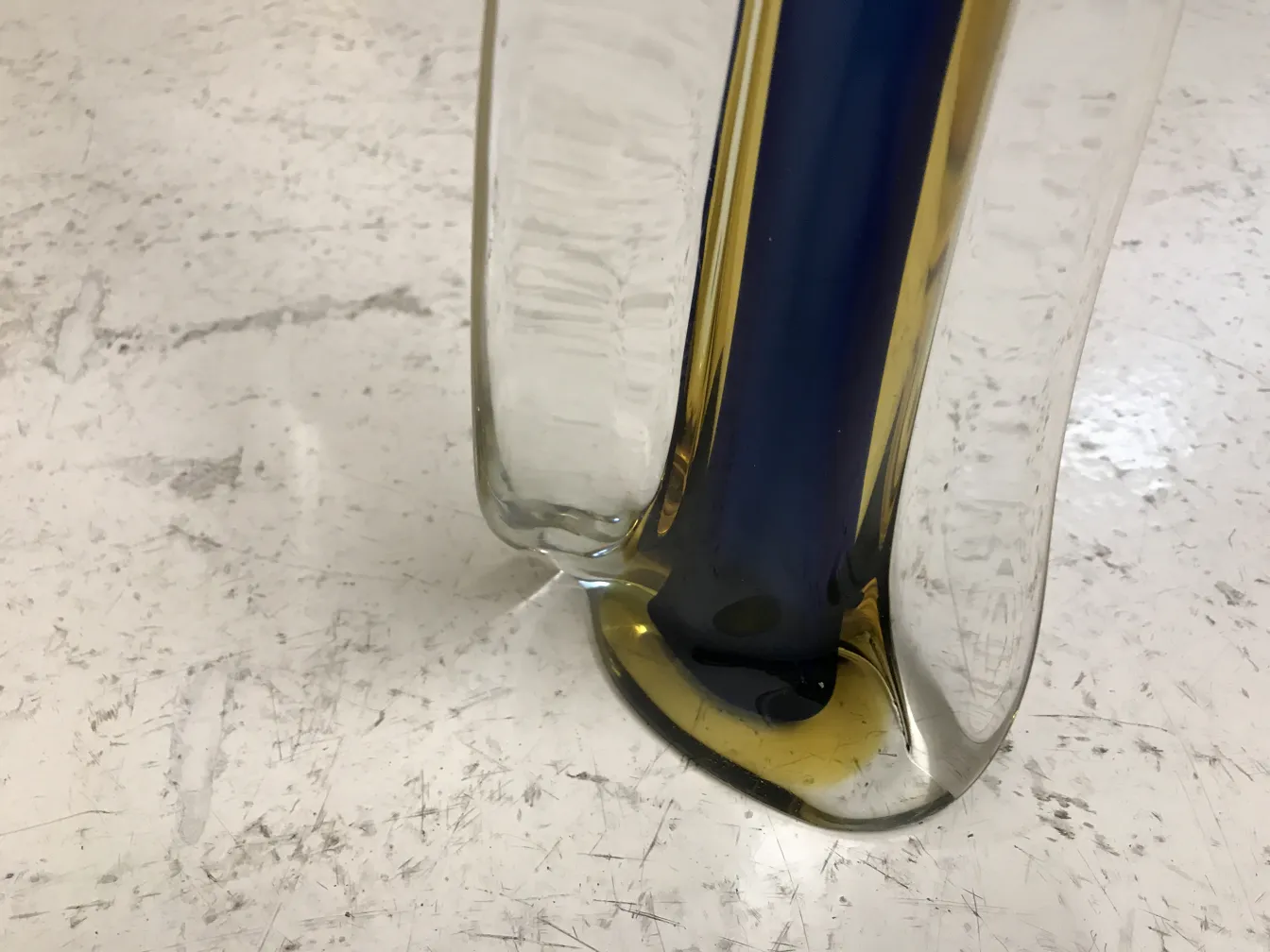 antique Murano vase in vibrant hues on a light background