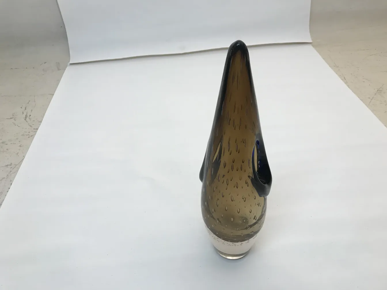 Antique Murano vase with conical shape and black details, set against a white background