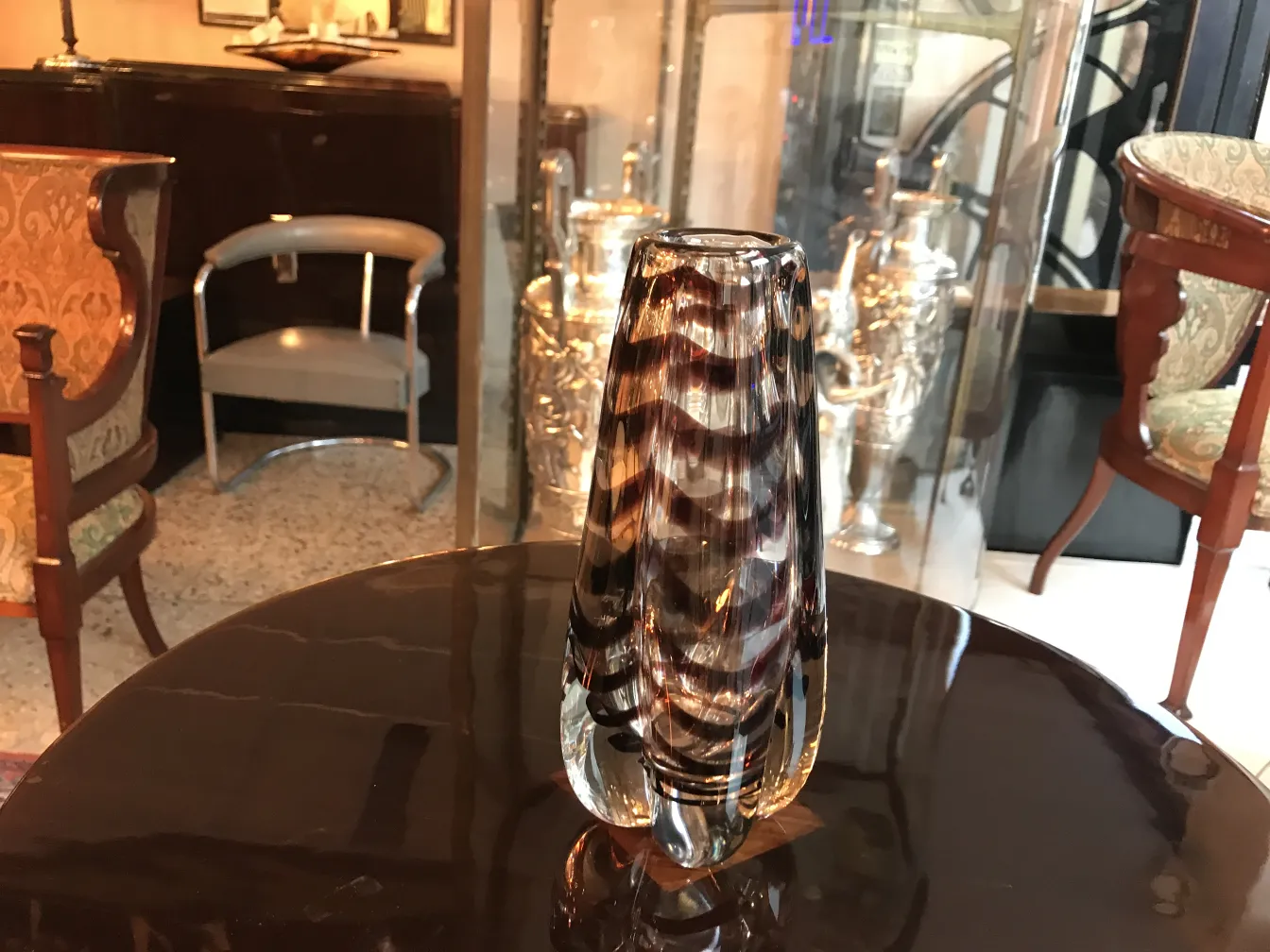 Antique Murano vase with distinctive design, in an elegant and sophisticated setting.