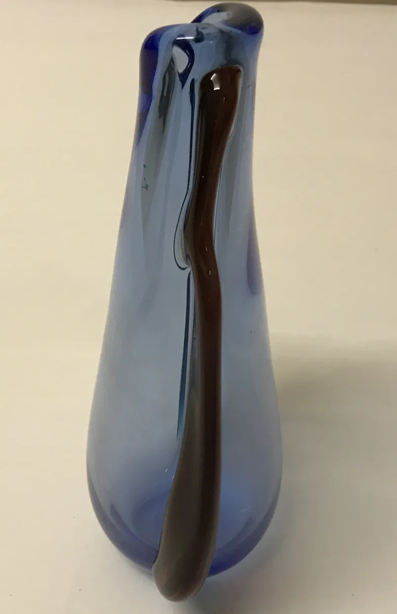 blue murano vase against a white background