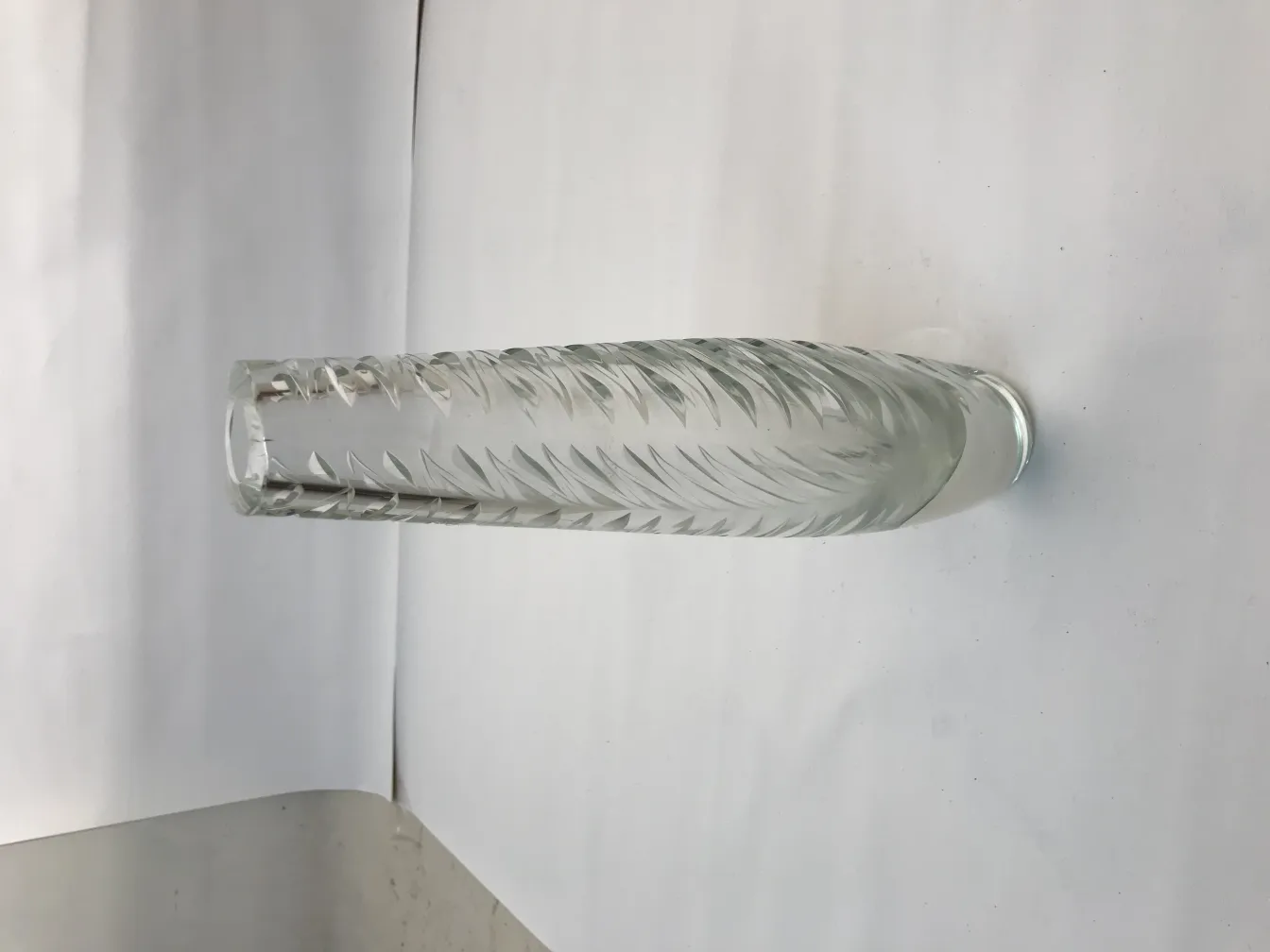 antique murano vase featuring carved details and elegant shape on white background