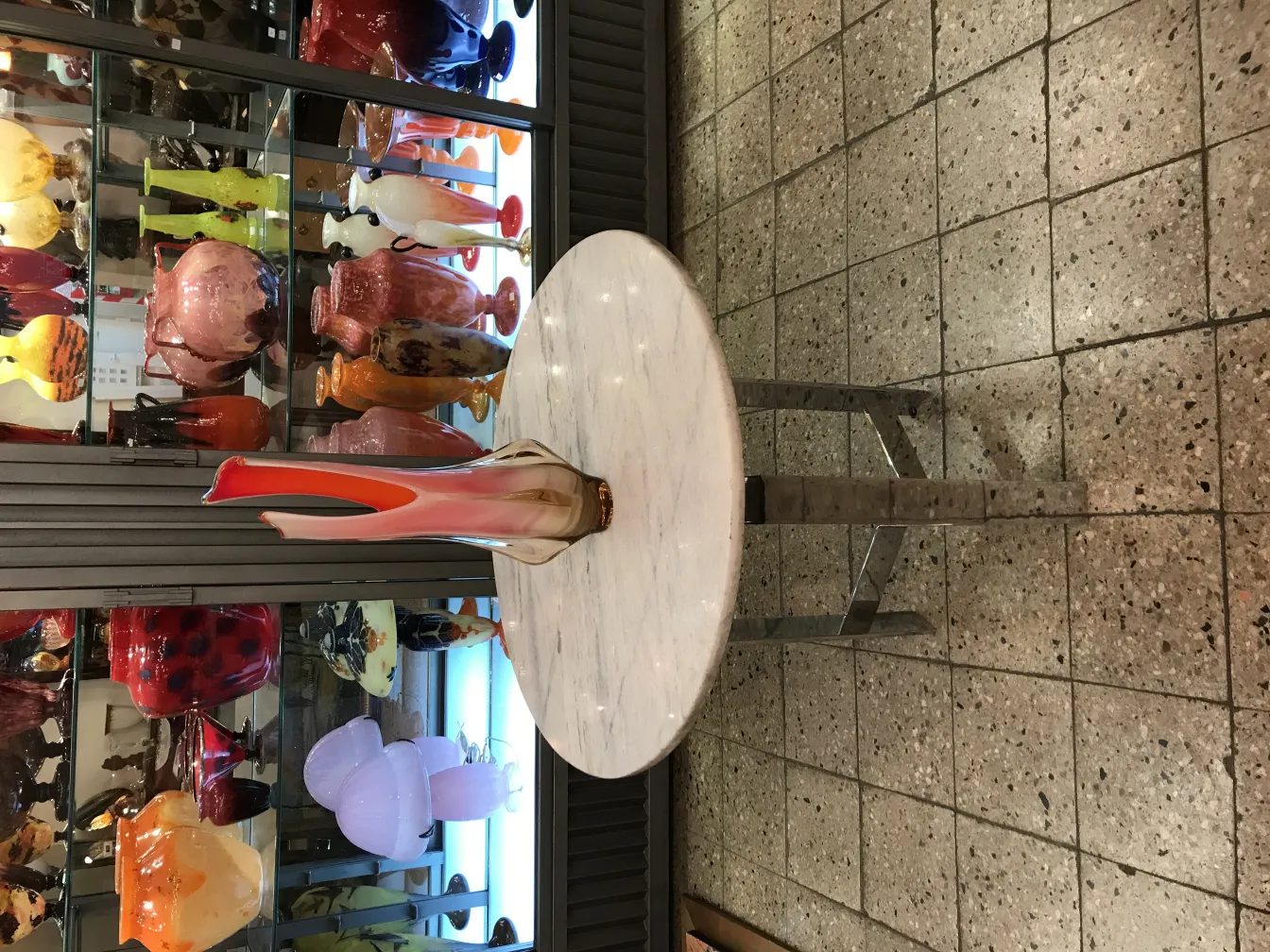 antique murano vase with colorful tones and elegant shapes in an antique setting