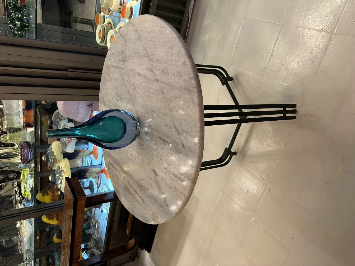 Antique Murano vase in blue tones on marble table