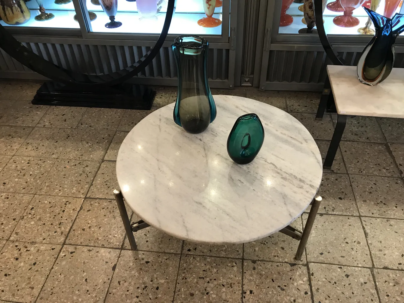 antique murano vase on marble table with decorative items