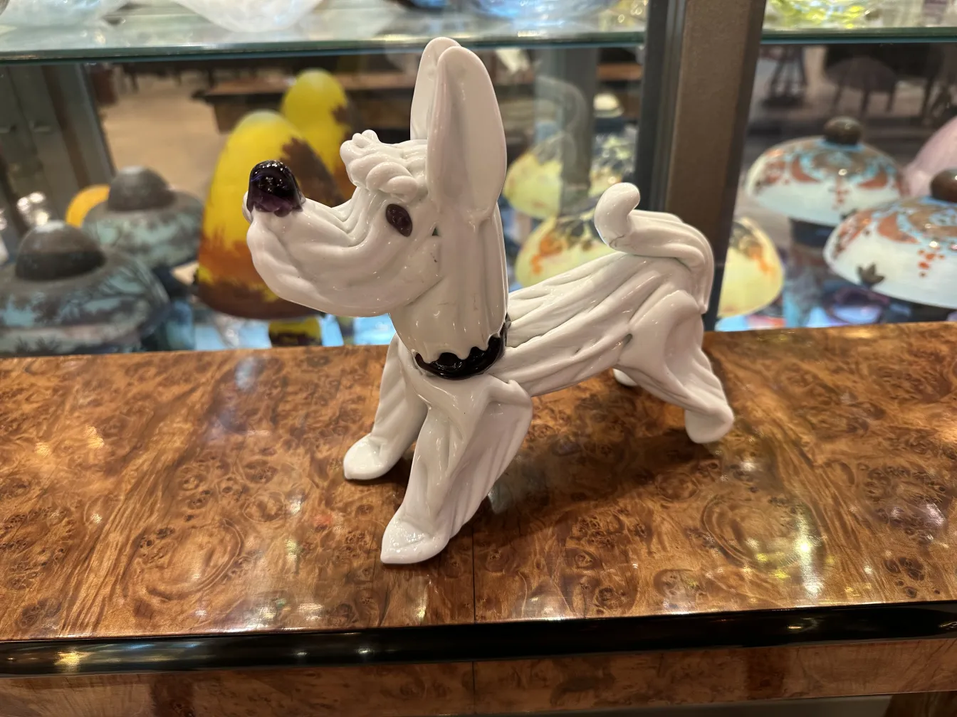 antique Murano dog sculpture with attractive background