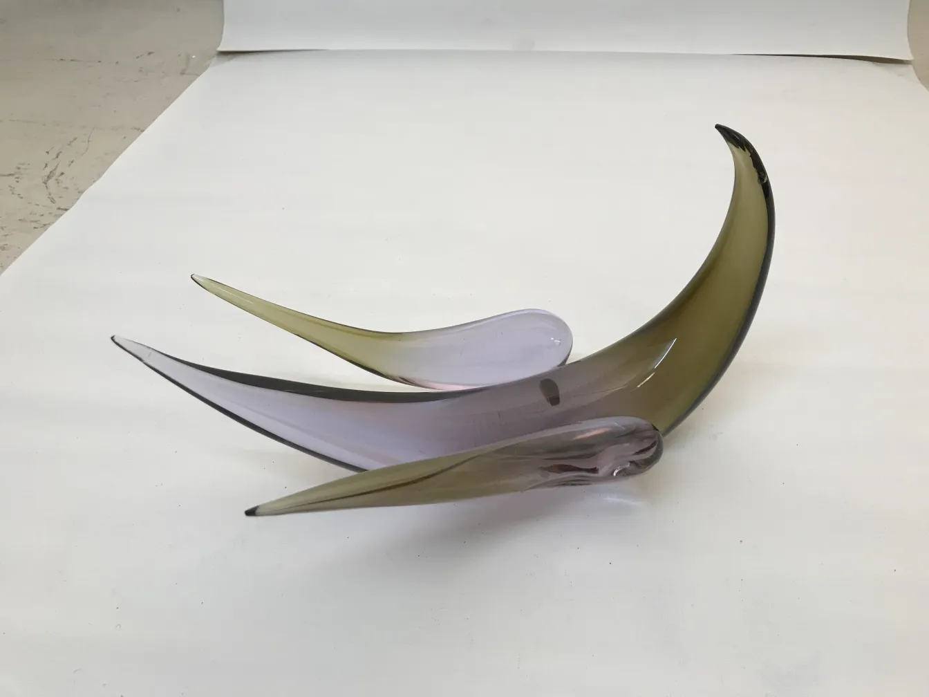 ancient murano sculpture with soft colors and elegant shapes in a bright setting