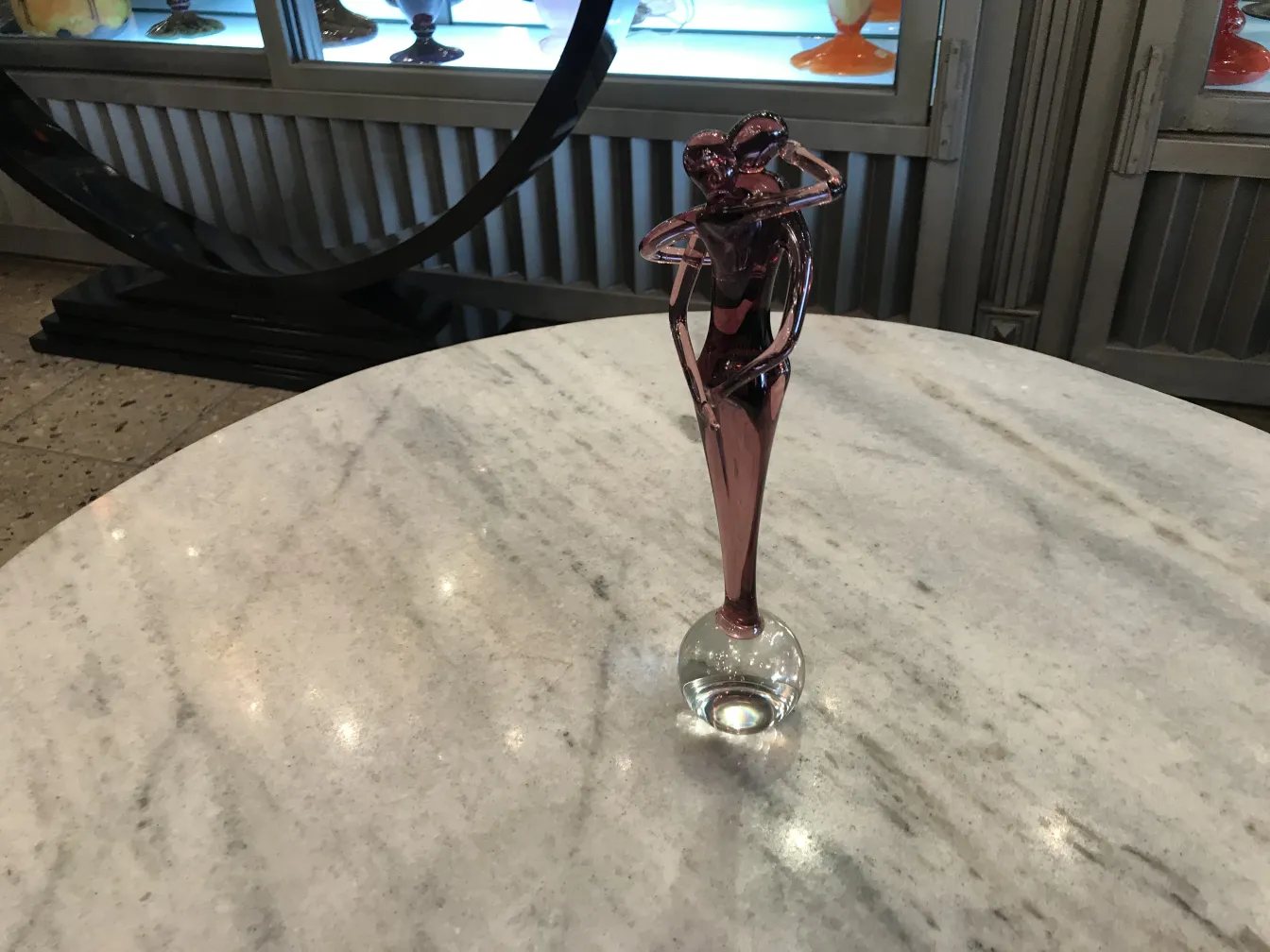 antique murano sculpture on marble table