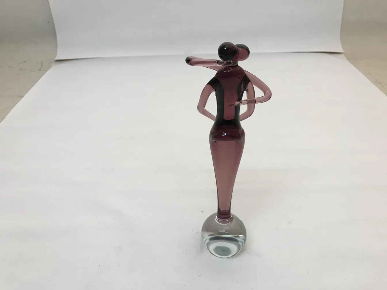 Antique Murano sculpture decorative figure in purple tones.