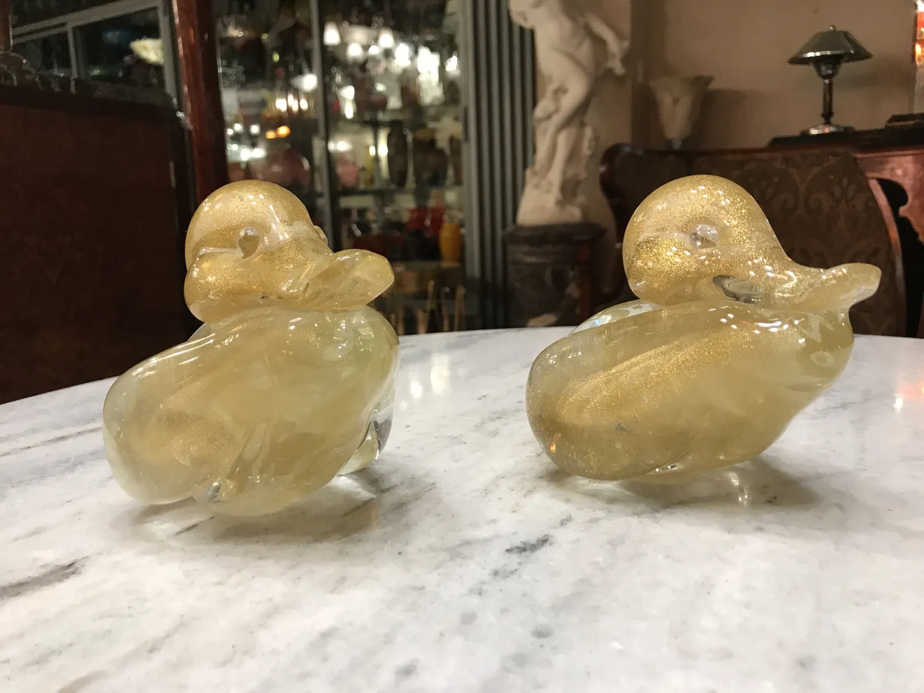 murano sculpture shaped like a duck, golden color, antique setting