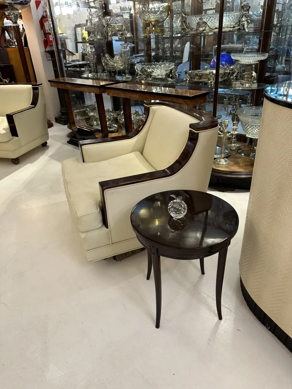 A Murano sculpture in an elegant setting with chairs and table.