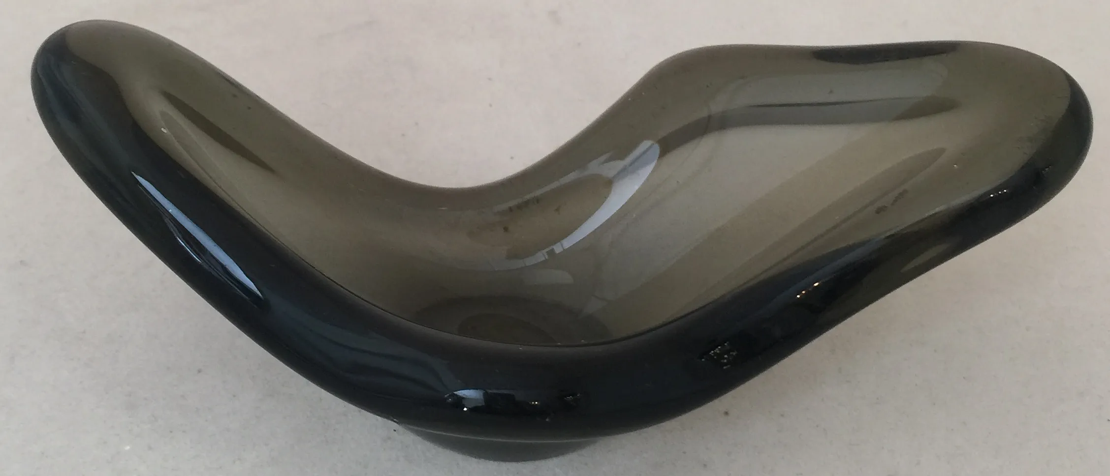 decorative wavy shape in dark murano glass