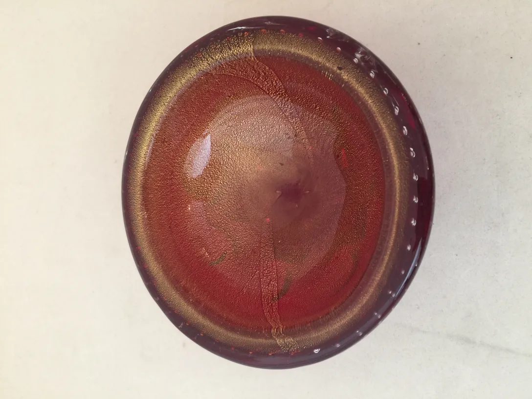 top view of an antique murano glass in red tones
