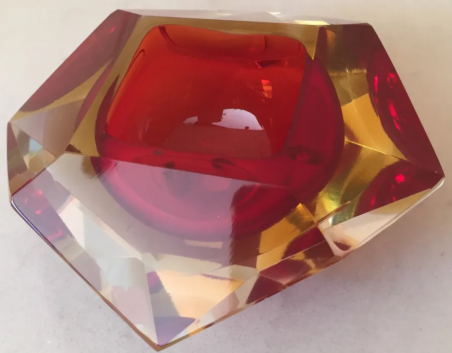 murano glass sculpture with red and yellow hues