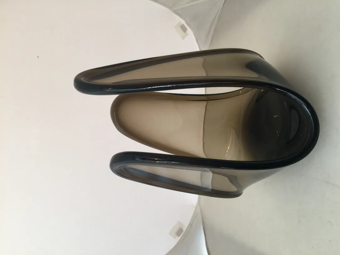 antique murano glass piece in dark tones, elegant curved shape
