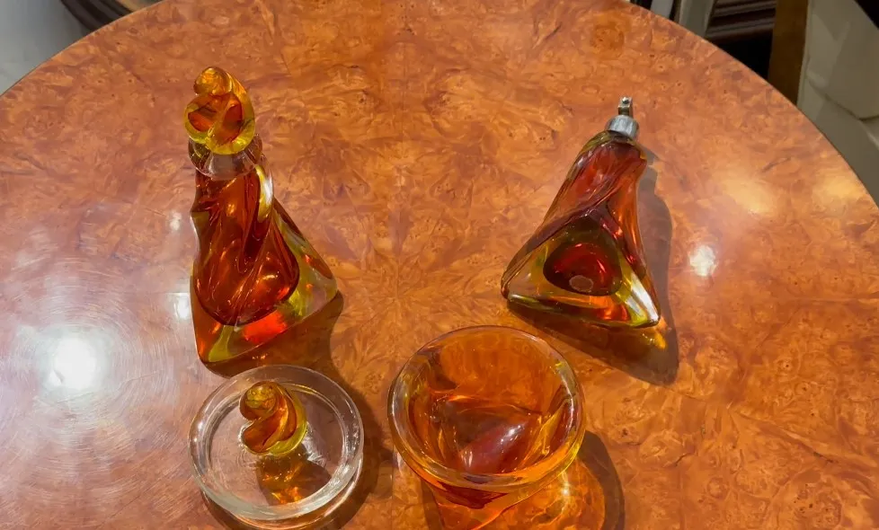 a set of decorative murano glass pieces in amber shades