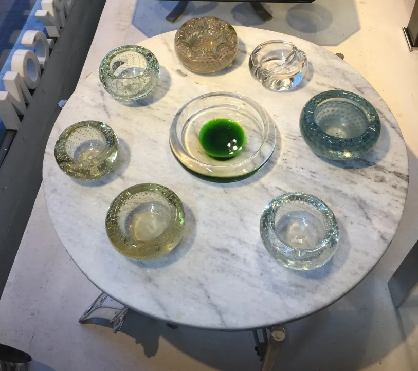 Antique Murano glass in various colors on marble table