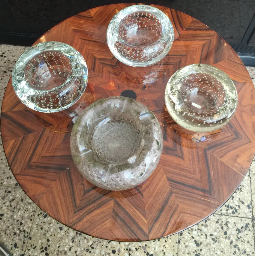four pieces of antique murano glass on a table