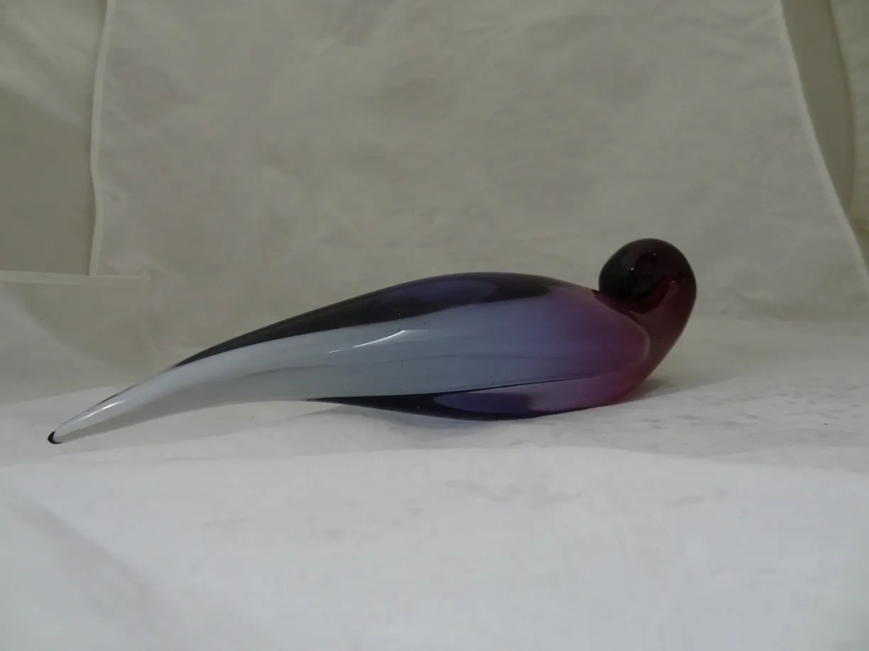 murano glass bird-shaped figure with purple hues