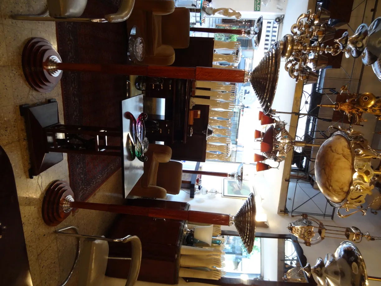 Antique Murano glass featuring vibrant colors and flowing shapes in an elegant setting.