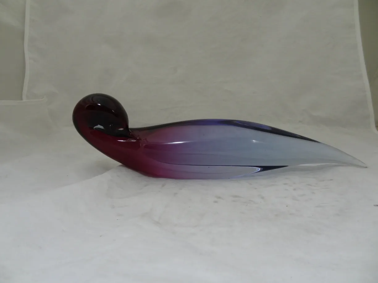 Murano glass shaped like a bird in purple hues