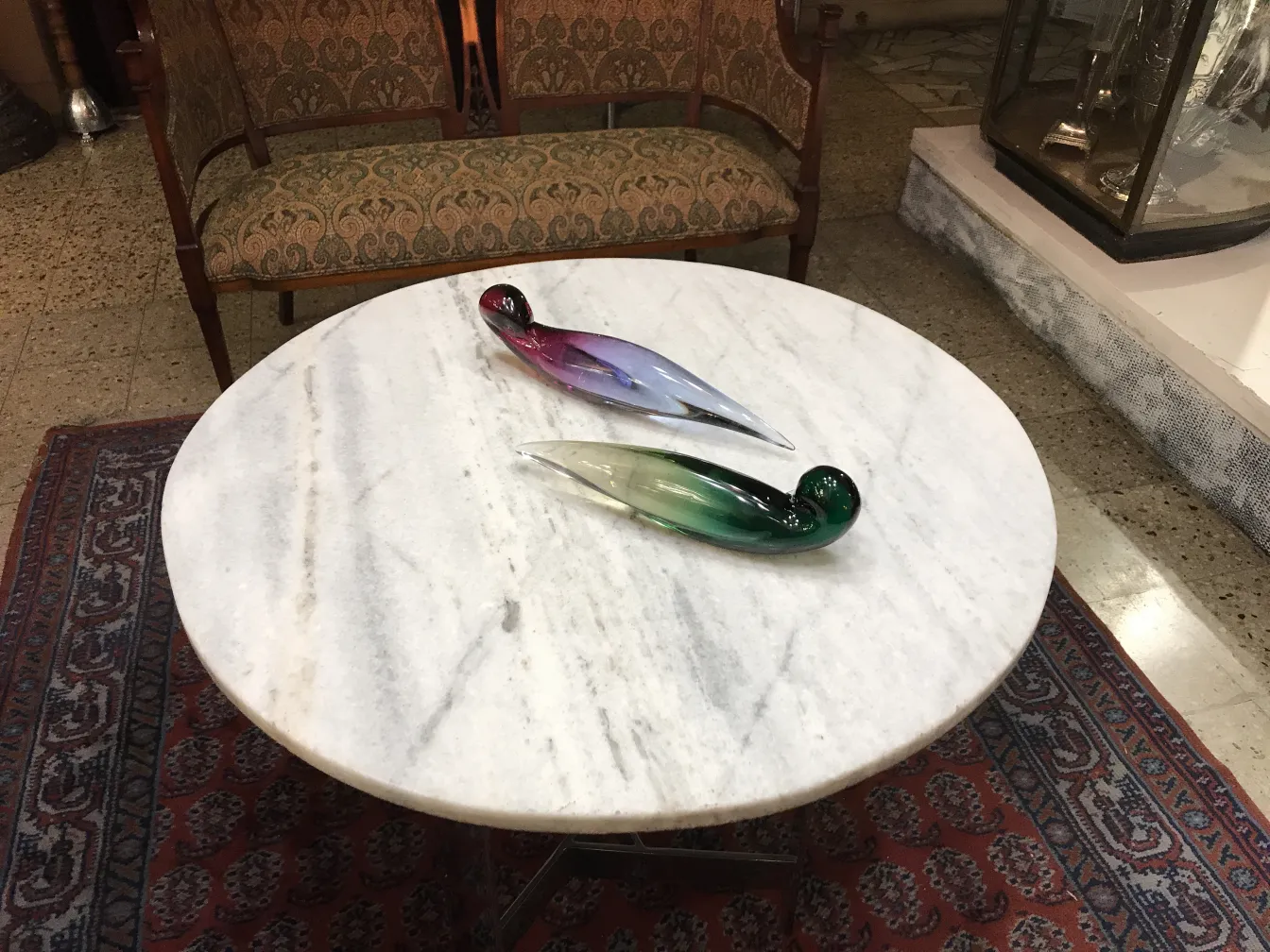 murano glass sculptures on round table
