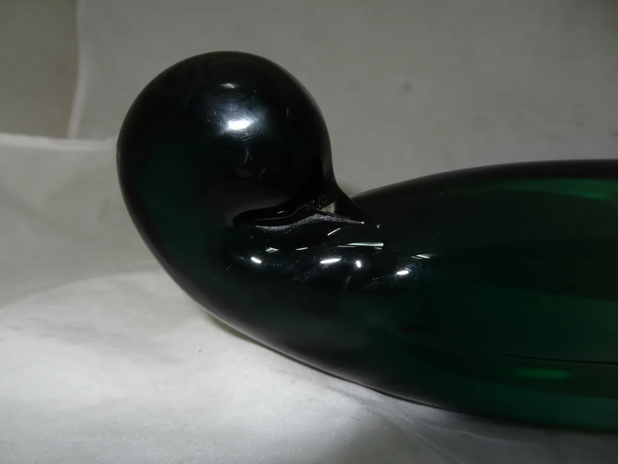 murano glass sculpture in green color, with flowing design