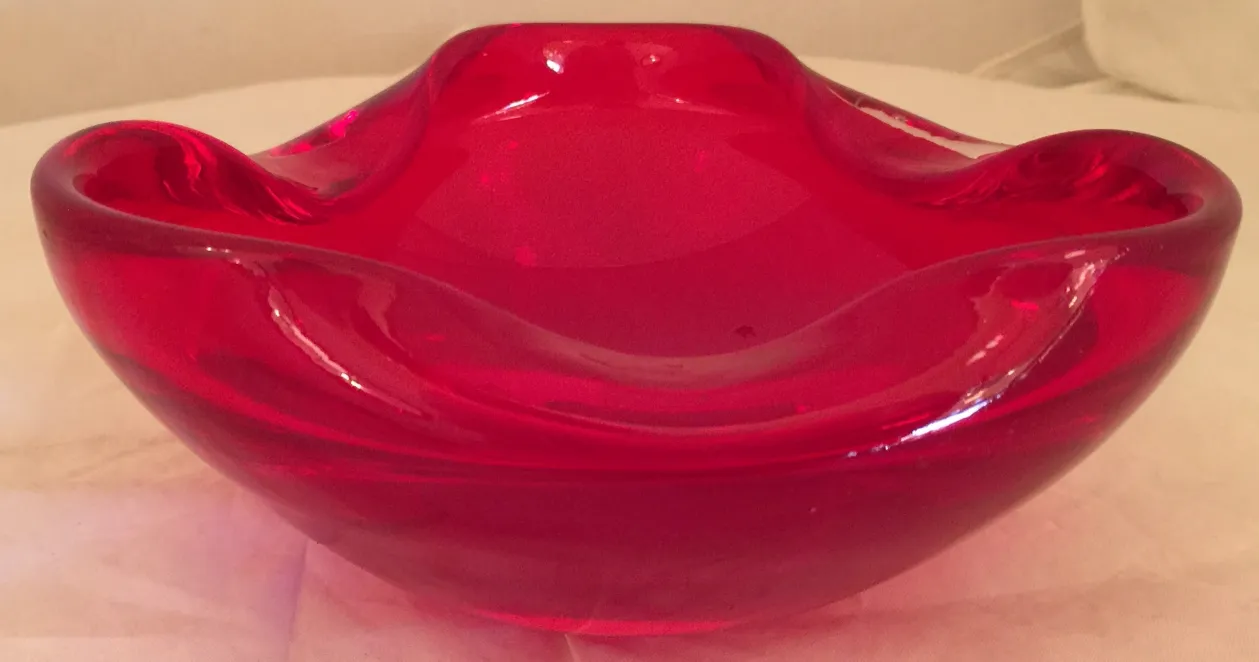 red murano glass decorative bowl with smooth shapes