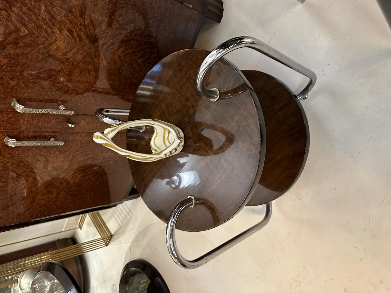 Antique Murano glass with soft color decoration, on wooden table.