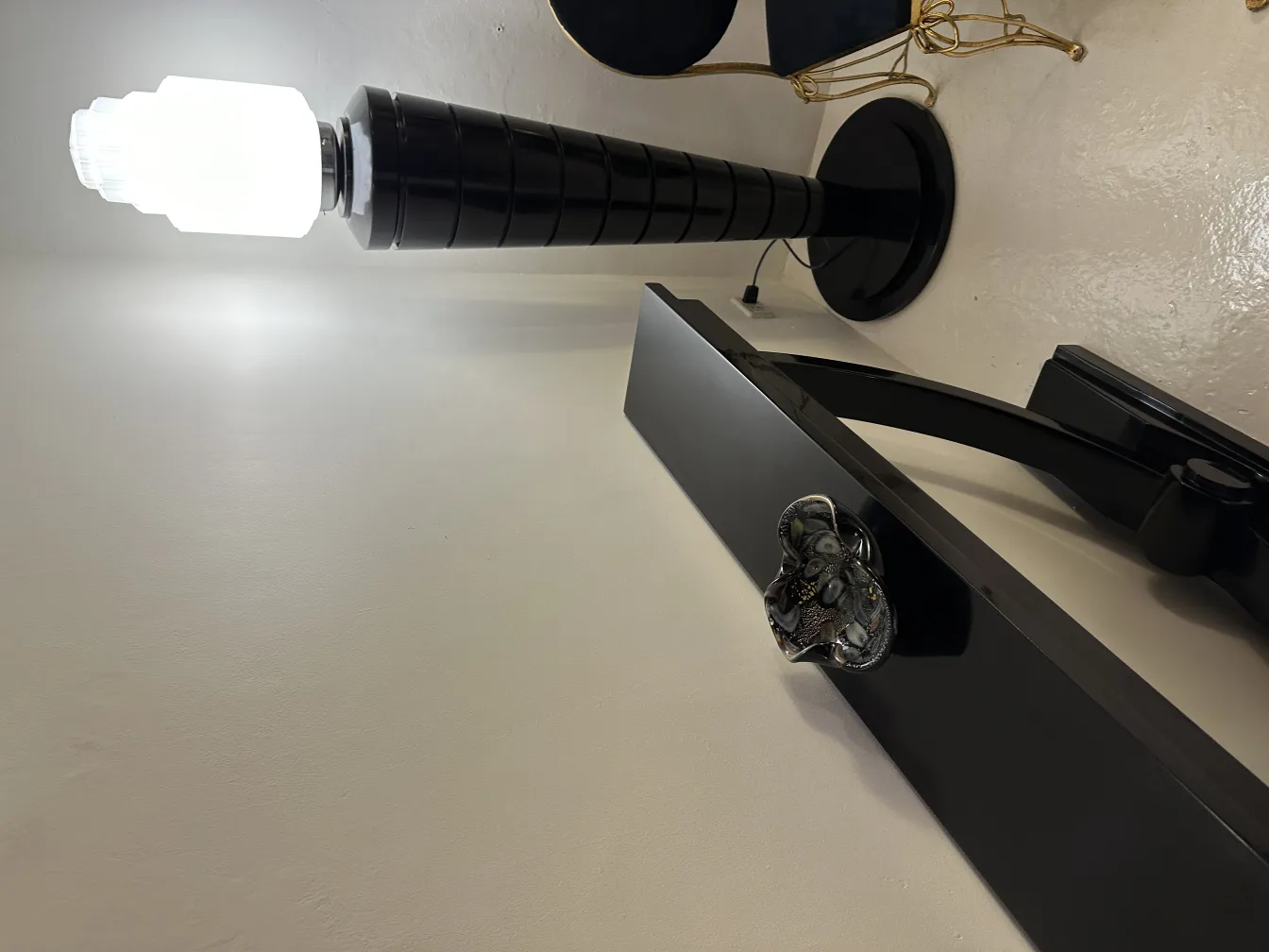 black floor lamp with decorative murano glass