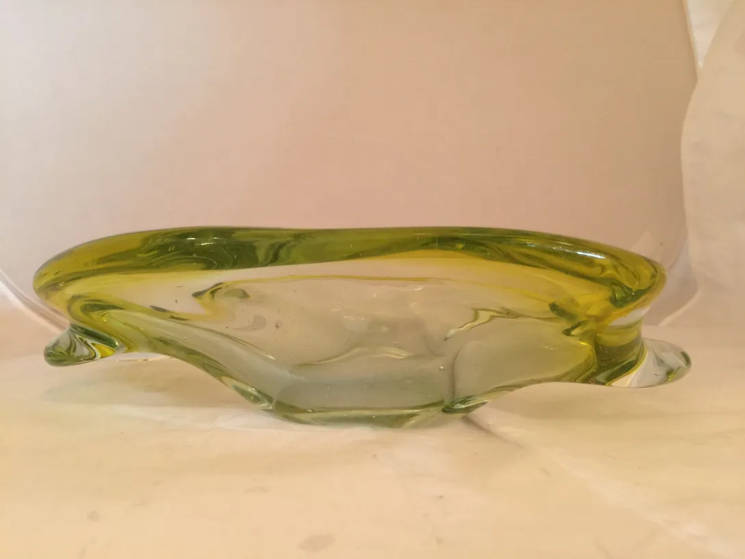 antique murano glass piece in green with fluid shape