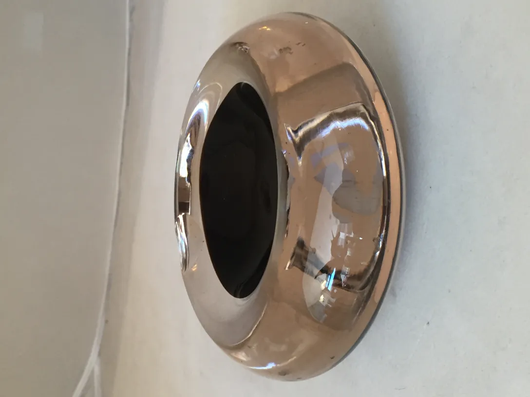 Antique Murano glass with elegant design and dark tones, perfect for decoration.